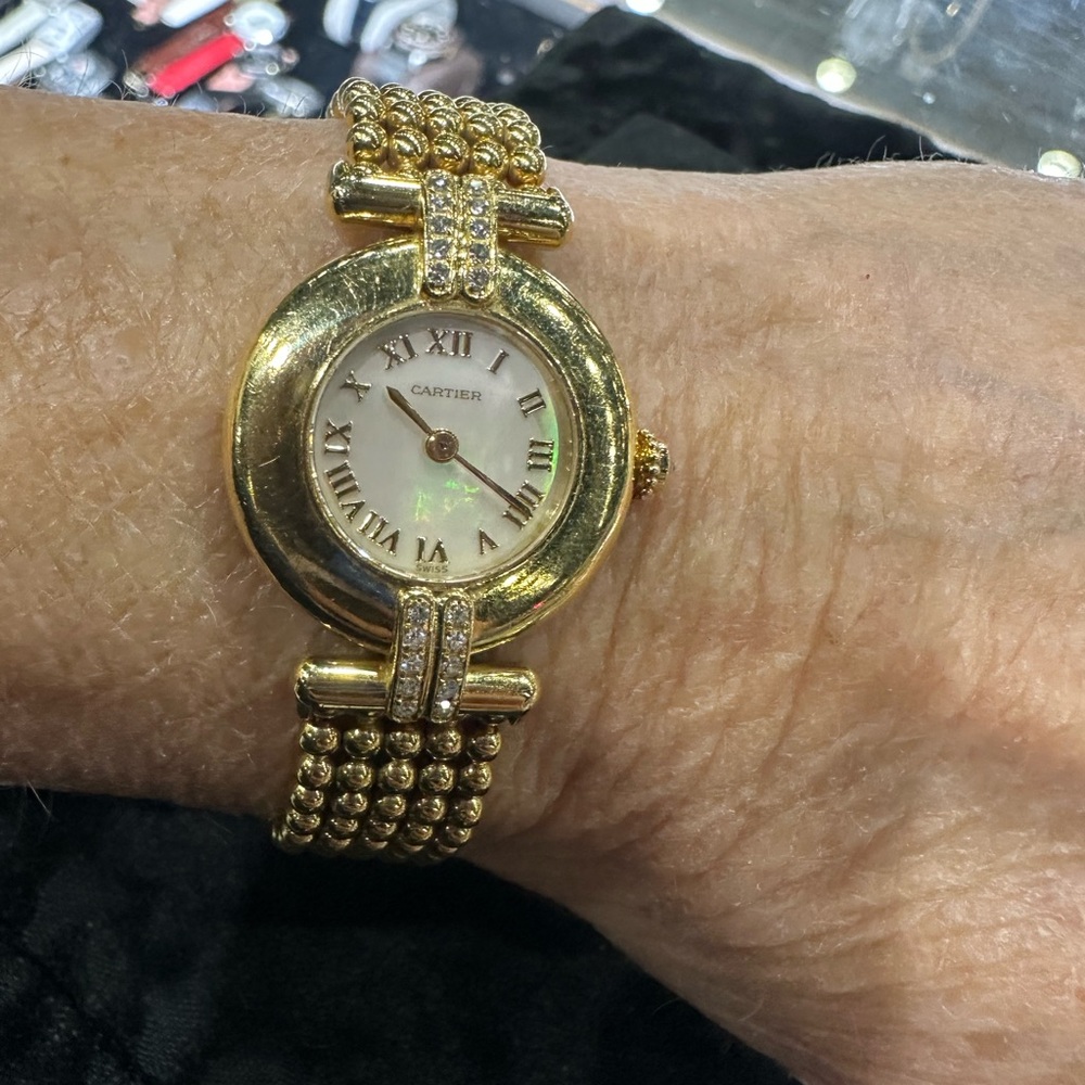 Cartier Collisee in 18k yellow gold with original mother of pearl dial.